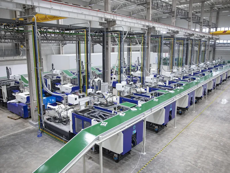 Plastic injection molding machine producing custom molded components